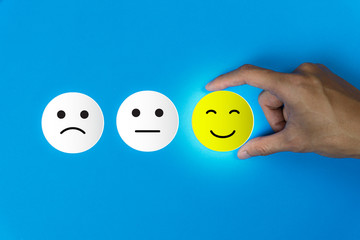 Conceptual the customer responded to the survey. The client using hand choose happy face smile icon...