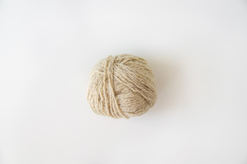 yarn ball for knitting wool, natural, beige on white background