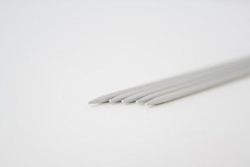 metal gray spokes on a white background, five pieces, hosiery spokes