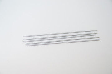 metal gray spokes on a white background, five pieces, hosiery spokes