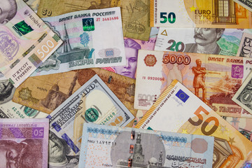 Multicurrency background of euros US dollars, Russian rubles, Egyptian pounds and Ukrainian hryvnias