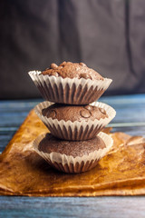 chocolate cupcakes with chocolate drops in rustic style