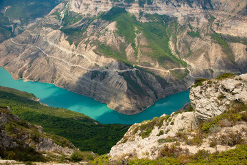Fototapeta na wymiar Mountain river landscape. Wild turquoise river in a mountain canyon, top view. The Sulak canyon Caucasus, Dagestan, Russia.