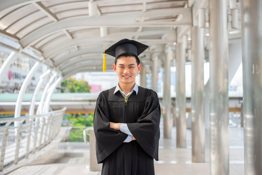 Graduate Student and Success Education in University Concept. Happy Asian student man graduate diploma and MBA degree in asian college.