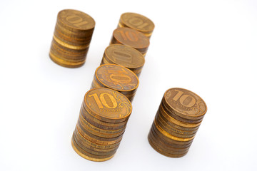 The percent sign laid out by piles of Russian 10-ruble coins. Close-up