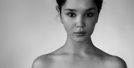 Natural beauty closeup. Black and white portrait of a young girl without makeup