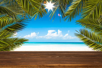 Table background with beautiful blue ocean and sandy beach view. Happy summer time. 