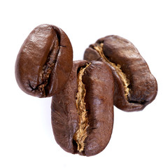 three coffee beans on white background. isolate. close up