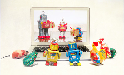 retro tin toys looking at a there friends celerbrating Christmas