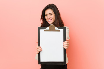 Young caucasian woman holding a clipboard