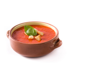 Tomato soup in brown bowl isolated on white background. Copyspace