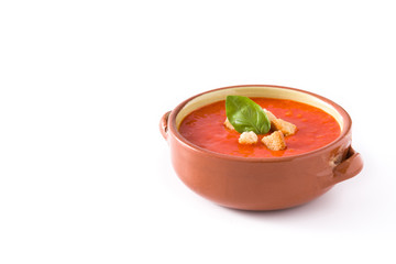 Tomato soup in brown bowl isolated on white background. Copyspace