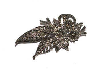 Silver and Jweleed Brooch on White Background