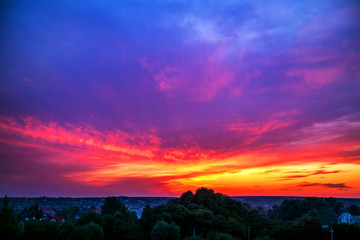 Beautiful summer sunset, iridescent purple, pink, red and yellow. Ukraine.