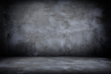Grunge interior room with concrete wall and floor. Empty concrete space.