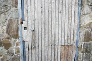 Old wooden doors with planks.