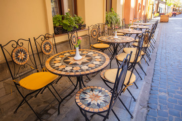 Mosaic tables in Lviv outdoor cafe 
