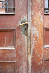 Old wooden doors with a handle. Vintage rustic style.