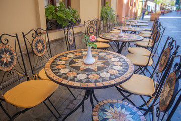 Mosaic tables in Lviv outdoor cafe 