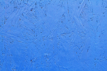 Blue painted OSB board as background, texture