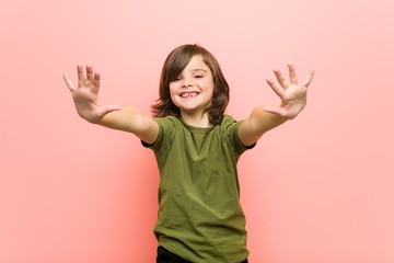 Little boy showing number ten with hands.
