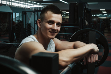 Fototapeta na wymiar Muscular man at gym