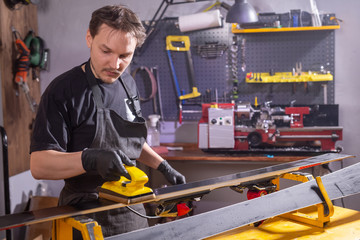 Repair and people concept - Ski repairing in the service