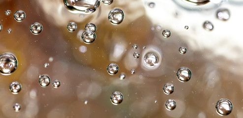 Bubbles of air on the surface of water as an abstract background
