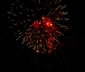 Fireworks sparkles in the night sky as background