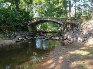 beautiful stone bridge over the river Kuja, beautiful morning light, deep shadows