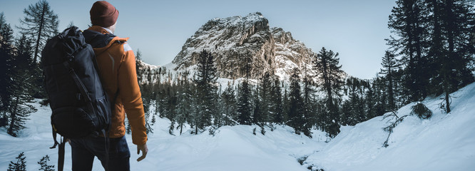 Hiker in winter landscape