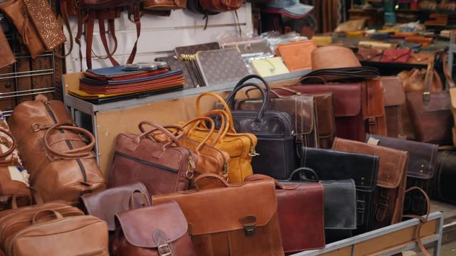 Marrakech - market stalls in Medina old city. Bags and leatherin  Marocco marketplace, craftsman product arabian