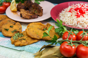 Traditional Indian food chicken tandoori and Tikka with garlic naan