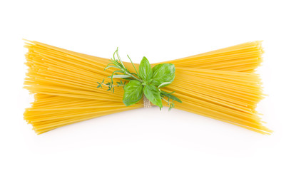 Spaghetti and basil isolated on white background.