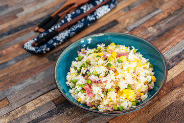 Homemade Chinese fried rice with vegetables and fried eggs
