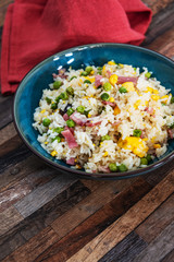 Homemade Chinese fried rice with vegetables and fried eggs