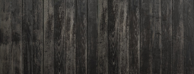 Black wood texture background coming from natural tree. The wooden panel has a beautiful dark...