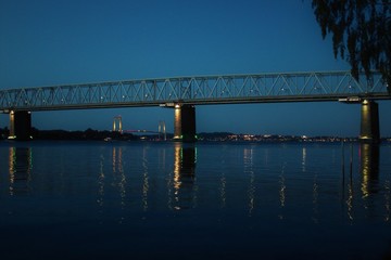 two bridges over the sea at night