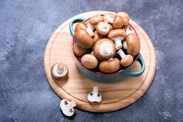 Brown champignons in bowl for cooking