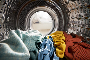 View Looking Out From Inside Washing Machine Filled With Laundry - obrazy, fototapety, plakaty