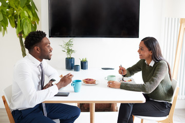 Business Couple At Home Eating Breakfast Before Leaving For Work
