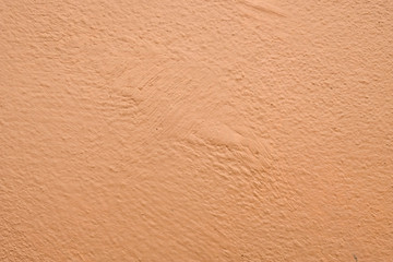 Brown cement wall background close up