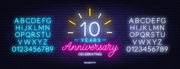 10 anniversary celebration neon sign on a dark background.