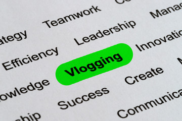 Obraz premium Vlogging - Technology Business Buzzwords, printed on white paper and highlighted