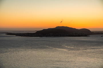 Alesund, Norway. Aerial view of Alesund, Norway at sunrise. Colorful sky over famous tourisitc destination with sunlight and mountains