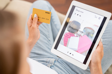 Young shopaholic going to look through new casualwear collection in online shop