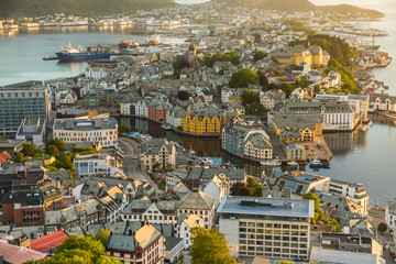Fototapeta premium From the bird's eye view of Alesund port town on the west coast of Norway, at the entrance to the Geirangerfjord. Colorful morning scene of the Nord. Traveling concept background.