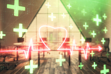 Double exposure of heart hologram on conference room background. Concept of medical education