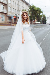portrait of the bride in the city, young beautiful wedding bride