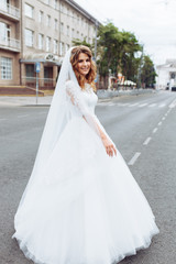 Obraz premium portrait of the bride in the city, young beautiful wedding bride